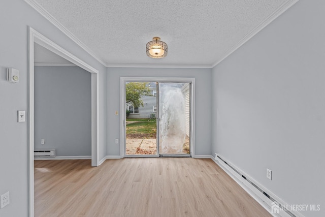 unfurnished room featuring a baseboard heating unit, crown molding, wood finished floors, and a baseboard radiator