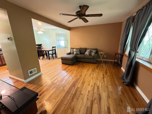 64 Bender Ave, Iselin, NJ 08830 - living area featuring light wood finished floors and a ceiling fan