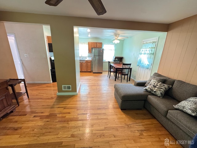 64 Bender Ave, Iselin, NJ 08830 - living room featuring a ceiling fan and light wood-style flooring
