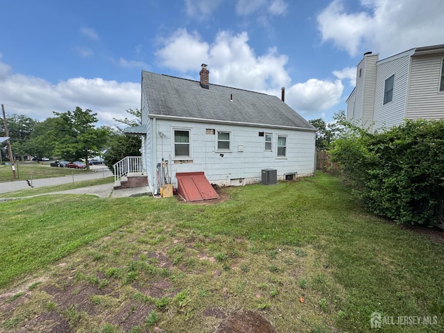 64 Bender Ave, Iselin, NJ 08830 - back of house with a chimney and a shingled roof