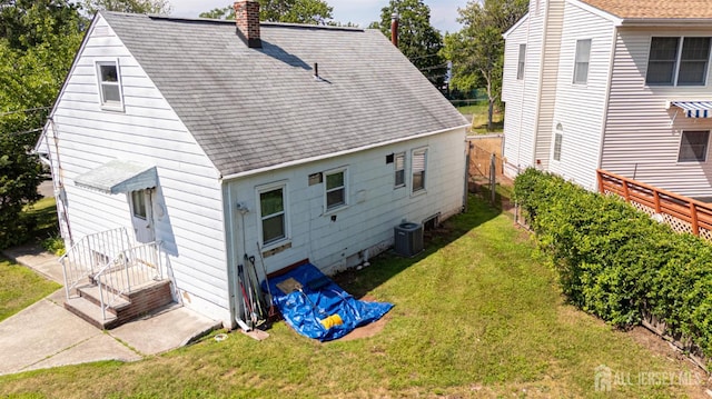 64 Bender Ave, Iselin, NJ 08830 - rear view of house featuring a chimney and roof with shingles