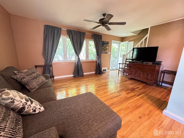 64 Bender Ave, Iselin, NJ 08830 - living room with wood finished floors, plenty of natural light, and ceiling fan