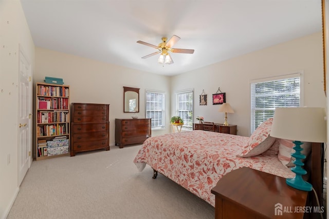 carpeted bedroom with ceiling fan