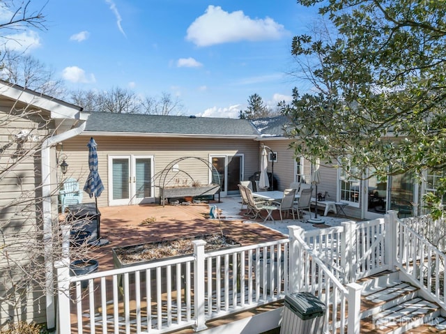 rear view of property with a patio area, a shingled roof, and a deck