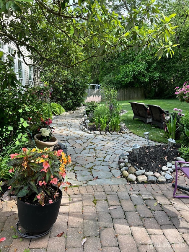 view of patio / terrace featuring fence