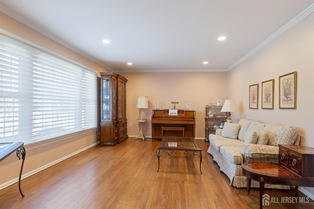 interior space featuring ornamental molding, recessed lighting, baseboards, and light wood finished floors