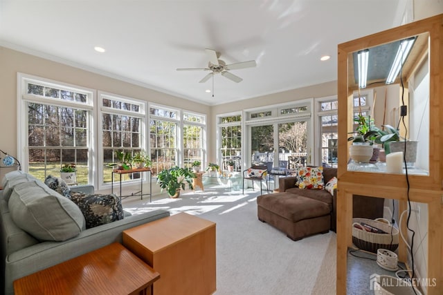 sunroom with a ceiling fan