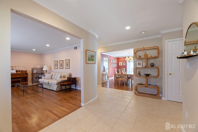 interior space with recessed lighting, visible vents, baseboards, ornamental molding, and light wood-type flooring