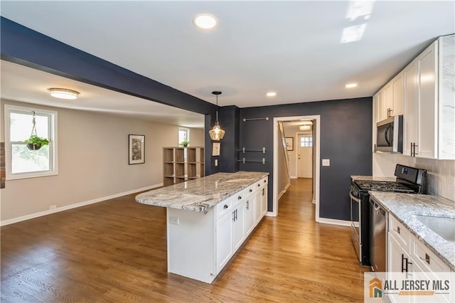 4 Woodrow St, Middlesex, NJ 08846 - kitchen featuring appliances with stainless steel finishes, white cabinets, light stone countertops, and recessed lighting