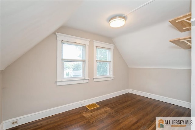 4 Woodrow St, Middlesex, NJ 08846 - bonus room with dark wood-style flooring and vaulted ceiling