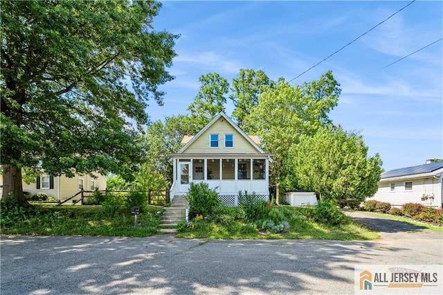 4 Woodrow St, Middlesex, NJ 08846 - view of front facade featuring a sunroom