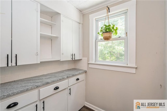 4 Woodrow St, Middlesex, NJ 08846 - kitchen with open shelves, tasteful backsplash, white cabinets, and hanging light fixtures