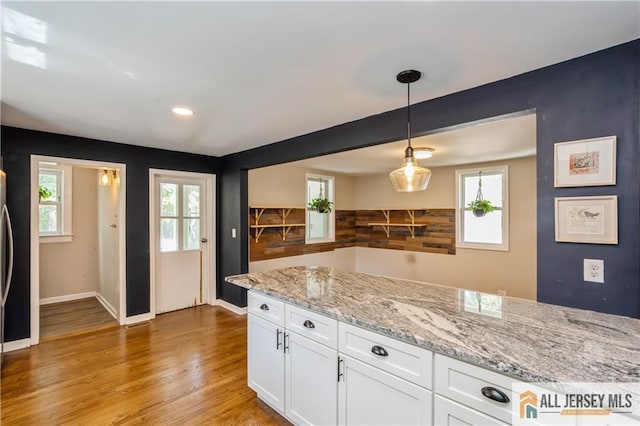 4 Woodrow St, Middlesex, NJ 08846 - kitchen featuring white cabinetry, light wood-style flooring, decorative light fixtures, light stone counters, and recessed lighting
