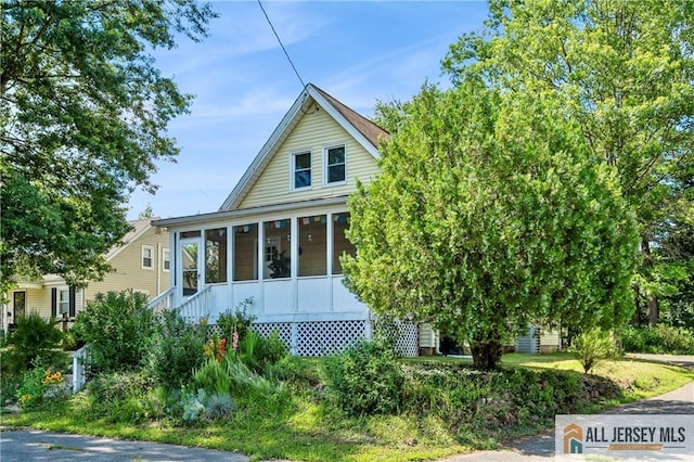 4 Woodrow St, Middlesex, NJ 08846 - view of front of house featuring a sunroom