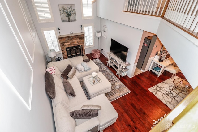 802 Carnaby Ln, Toms River, NJ 08753 - living room with a towering ceiling, wood finished floors, and a stone fireplace