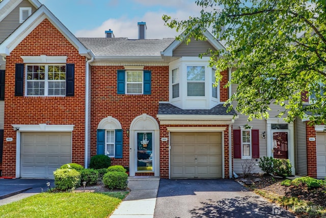 802 Carnaby Ln, Toms River, NJ 08753 - multi unit property featuring brick siding, driveway, roof with shingles, and an attached garage
