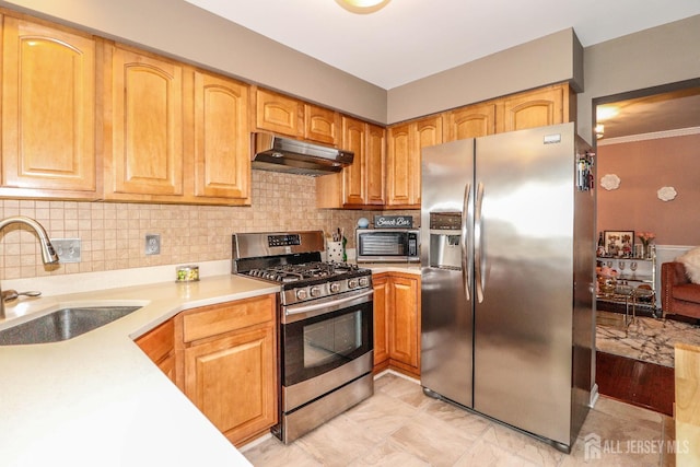 802 Carnaby Ln, Toms River, NJ 08753 - kitchen with appliances with stainless steel finishes, under cabinet range hood, light countertops, tasteful backsplash, and crown molding