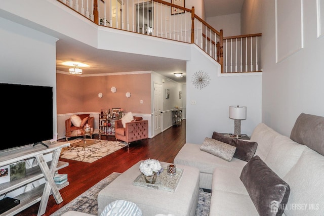 802 Carnaby Ln, Toms River, NJ 08753 - living room with wood finished floors, a towering ceiling, ornamental molding, and stairs