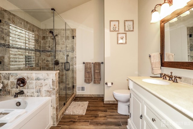 802 Carnaby Ln, Toms River, NJ 08753 - bathroom featuring vanity, a garden tub, a shower stall, and wood finished floors