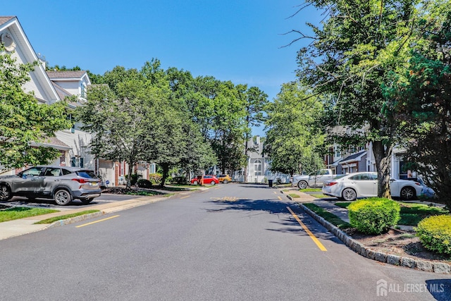 802 Carnaby Ln, Toms River, NJ 08753 - view of asphalt road with sidewalks and curbs