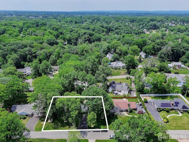 70 Surrey Ln, Woodbridge Proper, NJ 07067 - aerial perspective of suburban area with a heavily wooded area and property boundaries highlighted