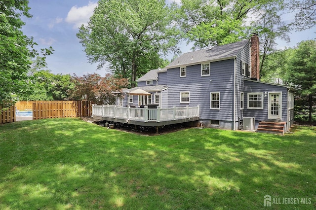 70 Surrey Ln, Woodbridge Proper, NJ 07067 - rear view of house featuring a chimney and a wooden deck