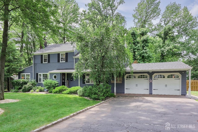 70 Surrey Ln, Woodbridge Proper, NJ 07067 - view of front of home featuring a garage, driveway, and roof with shingles