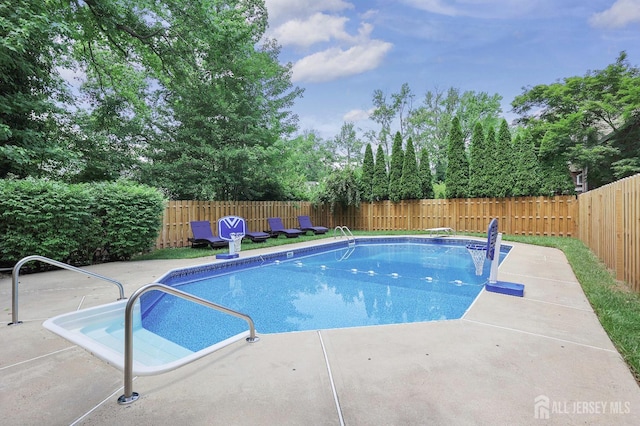 70 Surrey Ln, Woodbridge Proper, NJ 07067 - view of pool with a patio area, a fenced backyard, and view of wooded area