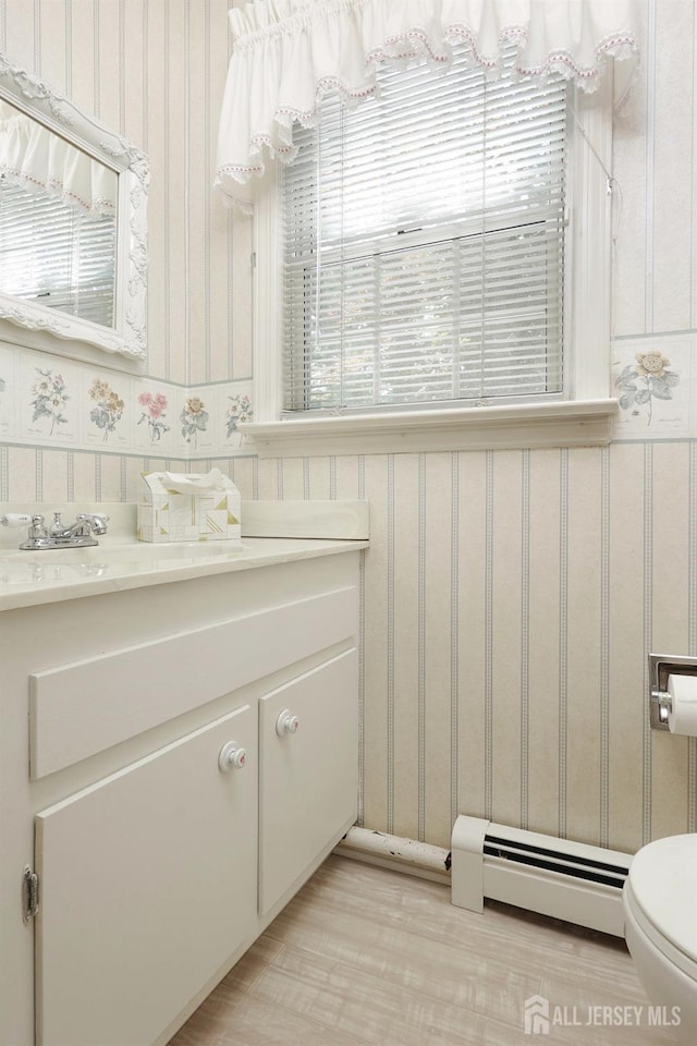 70 Surrey Ln, Woodbridge Proper, NJ 07067 - bathroom featuring wallpapered walls, vanity, and a baseboard radiator