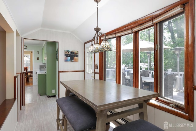 70 Surrey Ln, Woodbridge Proper, NJ 07067 - dining area featuring lofted ceiling, healthy amount of natural light, wainscoting, ornamental molding, and wooden walls
