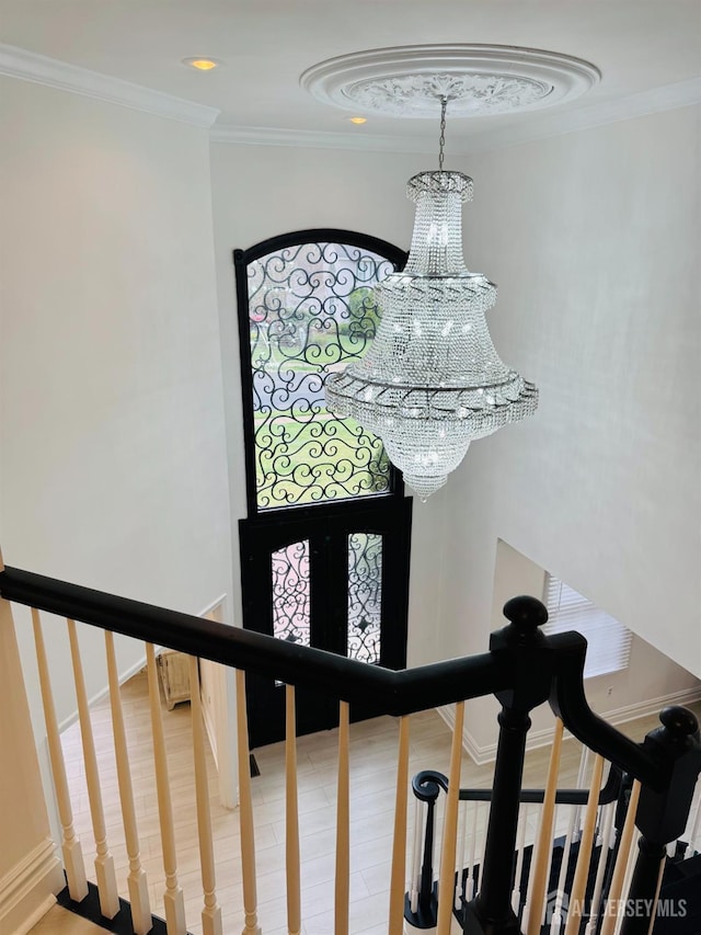 35 NE Bennett Rd, Old Bridge, NJ 07747 - staircase featuring crown molding, a notable chandelier, and baseboards