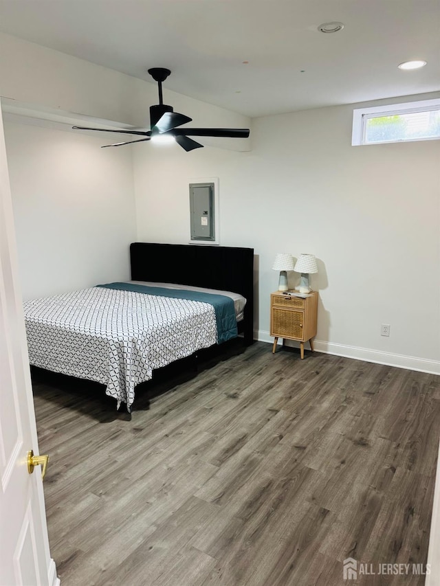 35 NE Bennett Rd, Old Bridge, NJ 07747 - bedroom featuring baseboards, ceiling fan, electric panel, and wood finished floors