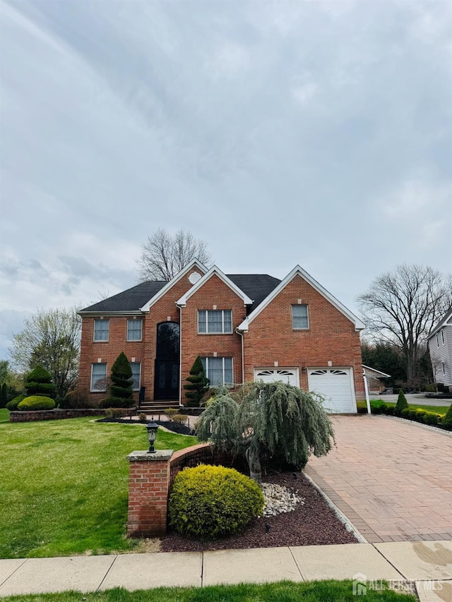 35 NE Bennett Rd, Old Bridge, NJ 07747 - traditional-style home with brick siding, an attached garage, decorative driveway, and a front yard