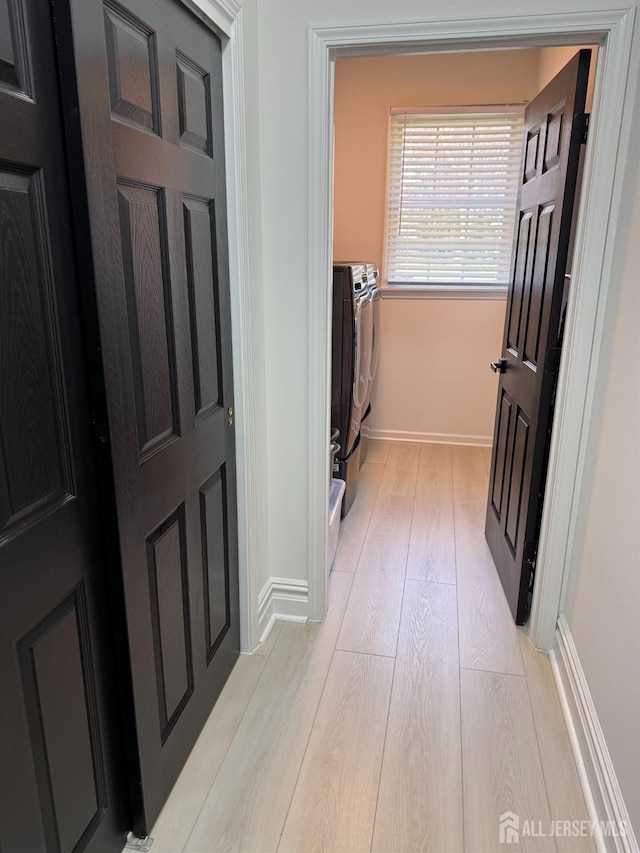 35 NE Bennett Rd, Old Bridge, NJ 07747 - laundry area featuring washing machine and dryer, laundry area, baseboards, and light wood-type flooring