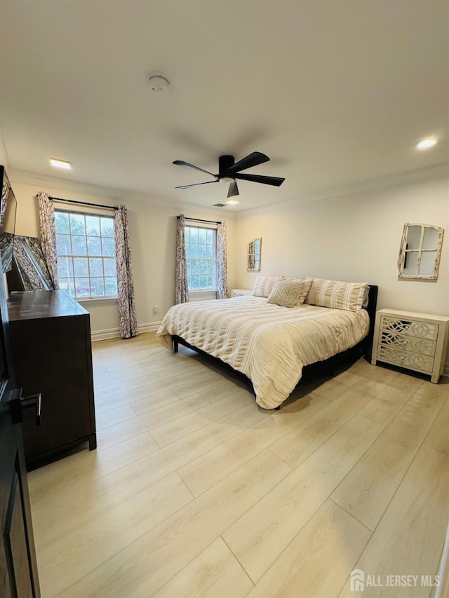 35 NE Bennett Rd, Old Bridge, NJ 07747 - bedroom featuring light wood-style flooring, crown molding, ceiling fan, and baseboards