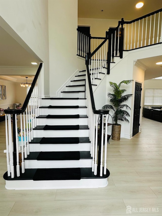 35 NE Bennett Rd, Old Bridge, NJ 07747 - stairs featuring wood finished floors, a towering ceiling, recessed lighting, a chandelier, and baseboards
