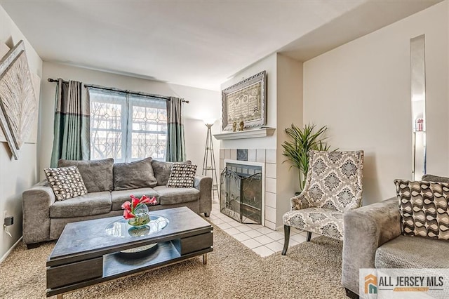 tiled living room with a tile fireplace