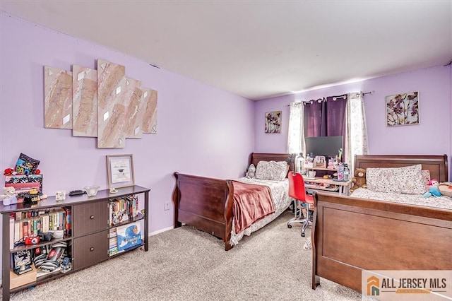 bedroom with light colored carpet