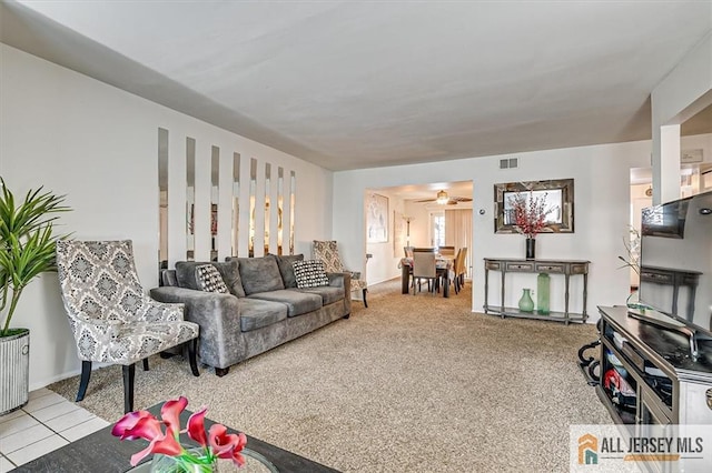 living room featuring light carpet