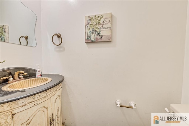 bathroom with vanity and toilet