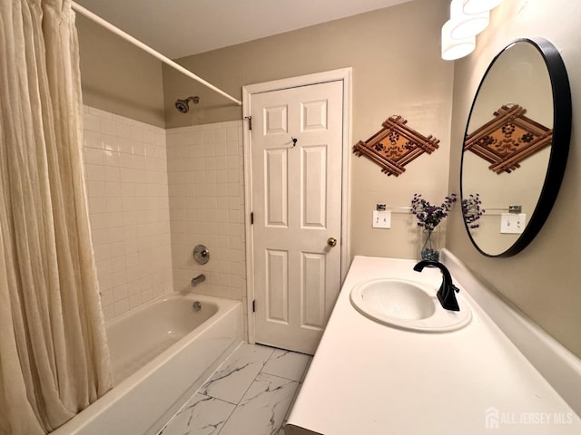 bathroom featuring vanity, shower / bath combo, and marble finish floor