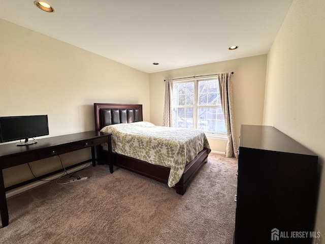 carpeted bedroom with recessed lighting