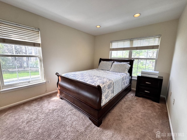 bedroom featuring baseboards, carpet flooring, and recessed lighting
