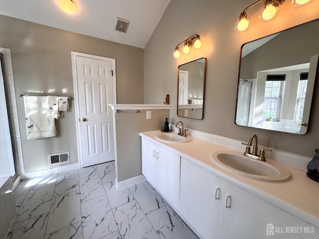 bathroom with a sink, visible vents, a shower with shower door, and marble finish floor