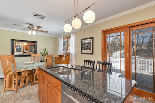 kitchen with sink, hanging light fixtures, a center island with sink, stainless steel dishwasher, and dark stone counters