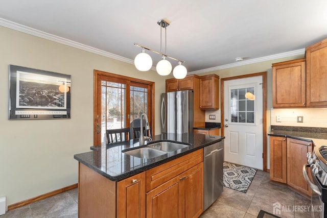 kitchen featuring sink, decorative light fixtures, a center island with sink, dark stone countertops, and stainless steel appliances