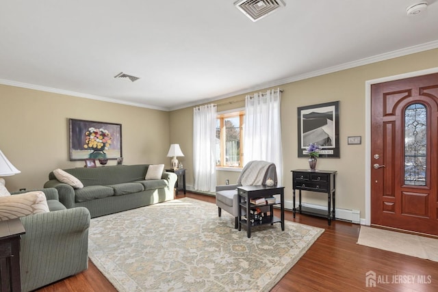 living room with ornamental molding, a baseboard heating unit, and dark hardwood / wood-style flooring