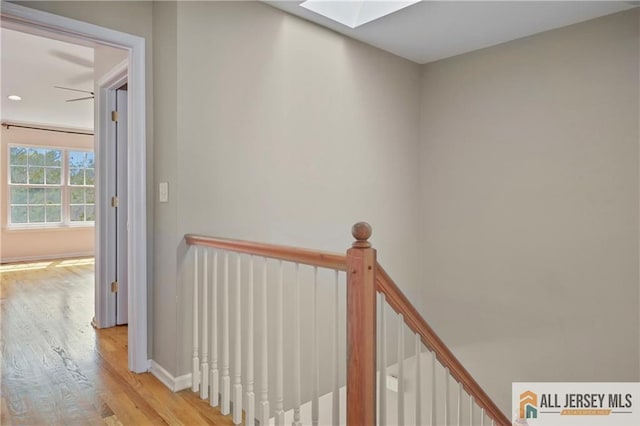 21 Capica Ct Unit 89, South Amboy, NJ 08879 - hall featuring wood finished floors, an upstairs landing, and a skylight