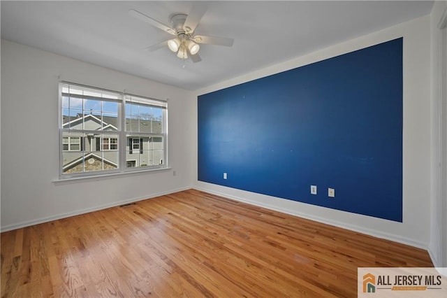 21 Capica Ct Unit 89, South Amboy, NJ 08879 - unfurnished room featuring wood finished floors and a ceiling fan
