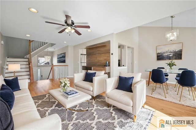 21 Capica Ct Unit 89, South Amboy, NJ 08879 - living room featuring wood finished floors, ceiling fan, recessed lighting, a chandelier, and stairs